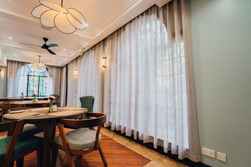 Restaurant interior with sheer curtains