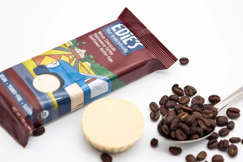 Edie's coffee white chocolate cups with coffee beans on a spoon