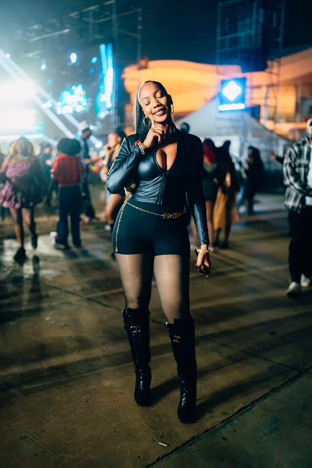 Festival-goer in leather posing in the crowd