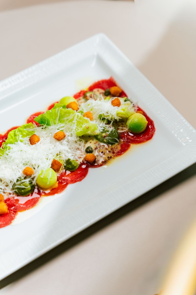 Beef carpaccio with parmesan and croutons
