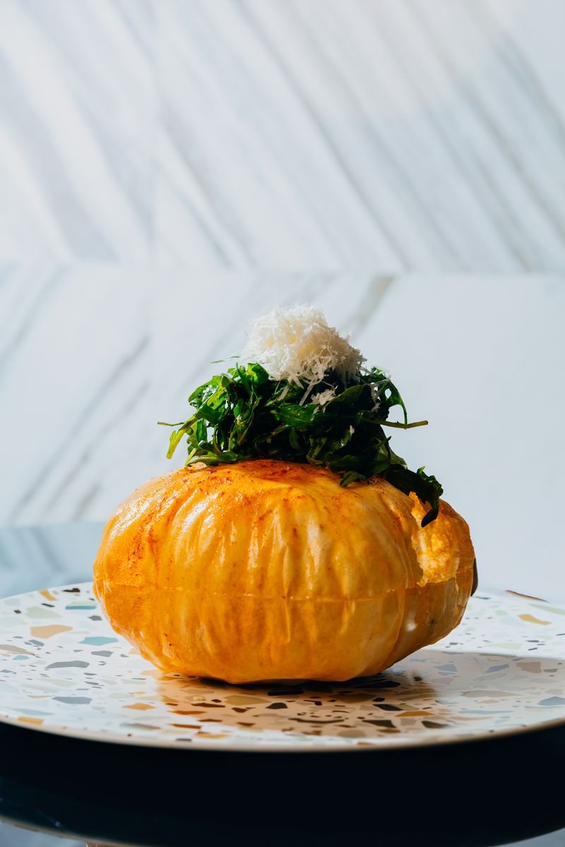 Stuffed pumpkin with arugula and parmesan