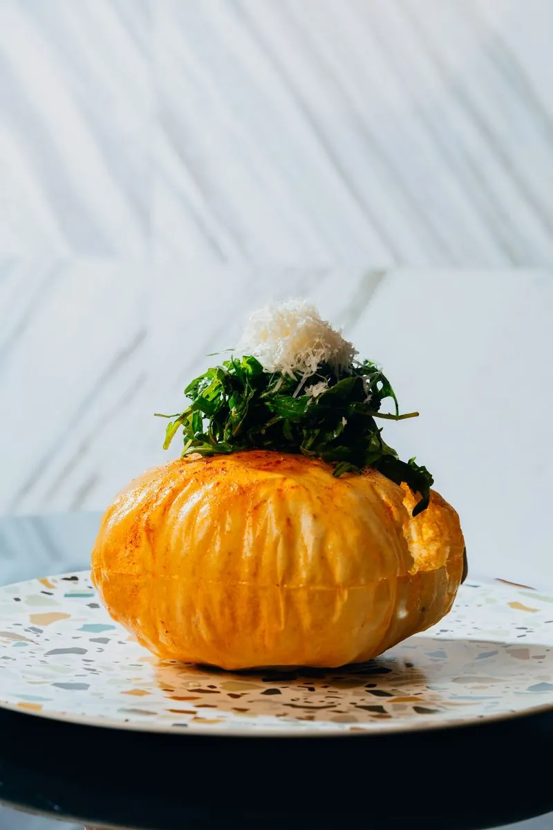 Stuffed pumpkin with arugula and parmesan