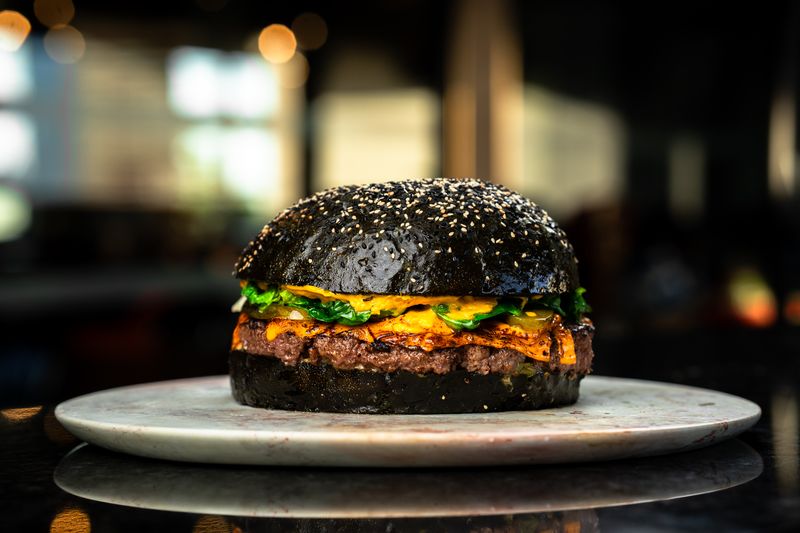 Black bun cheeseburger