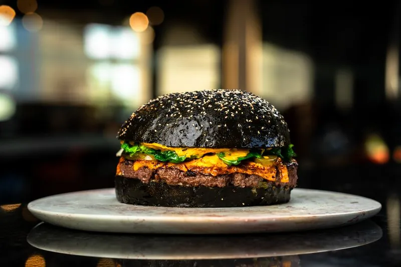 Black bun cheeseburger