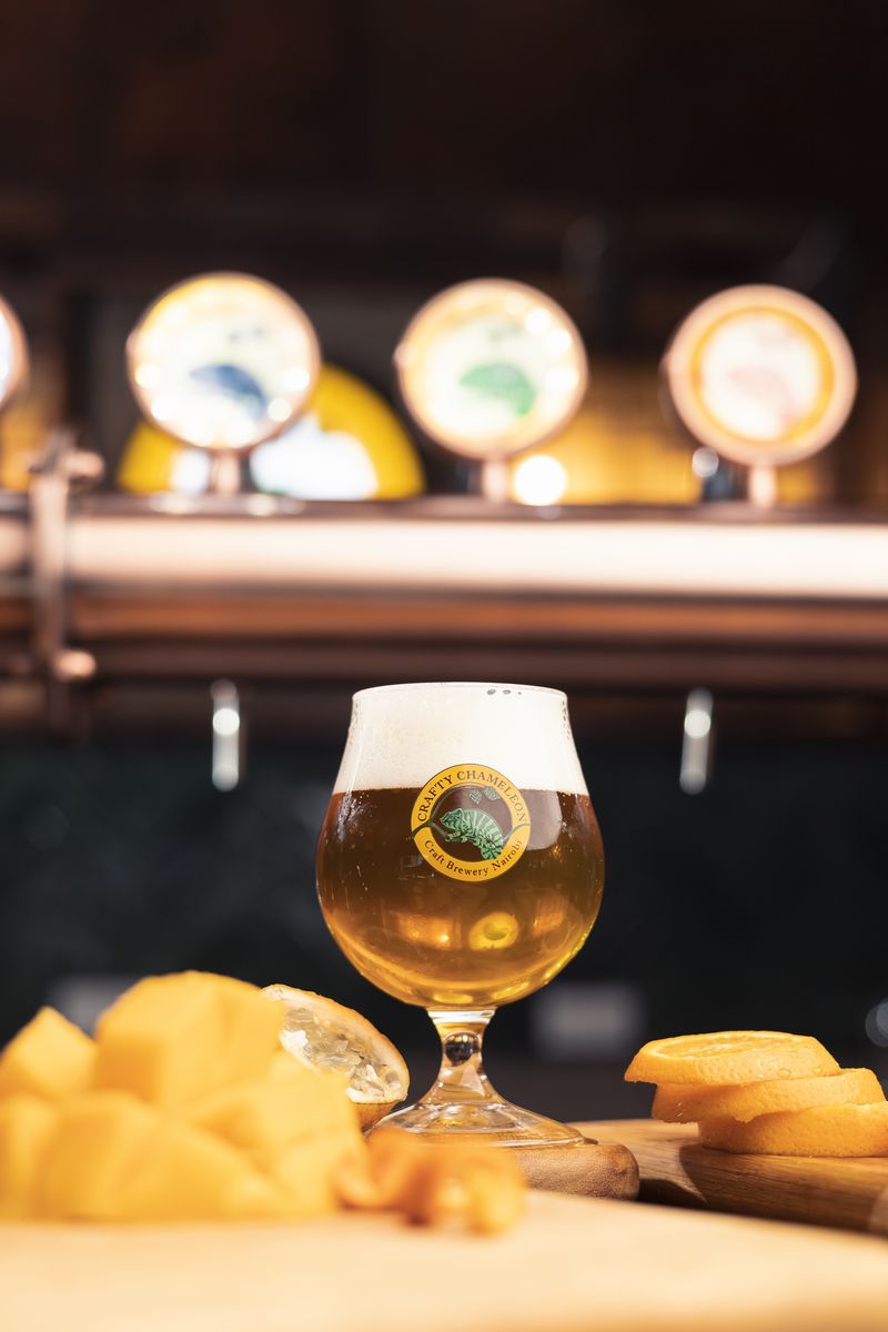 Tulip glass amber beer with fruit board