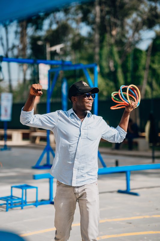 Player celebrating with rope rings raised, mid-throw