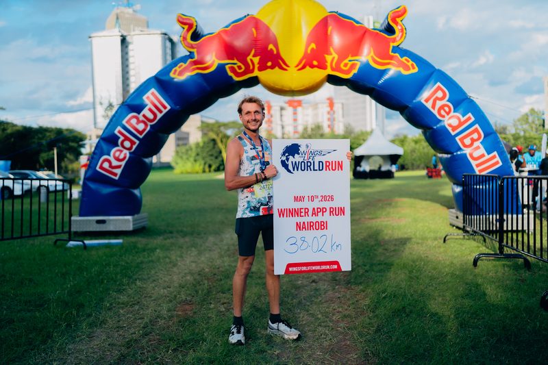 Steffen under the Red Bull arch holding the winner sign — 38.02 km